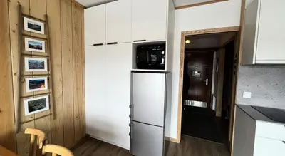Cuisine ou kitchenette dans l'établissement Résidence Bec Rouge - Sur les pistes, studio de charme MAE-3662