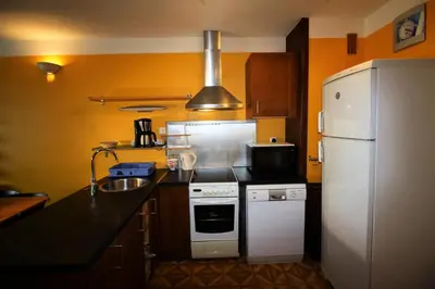 Cuisine ou kitchenette dans l'établissement Résidence Bec Rouge - Sur les pistes MAE-3752
