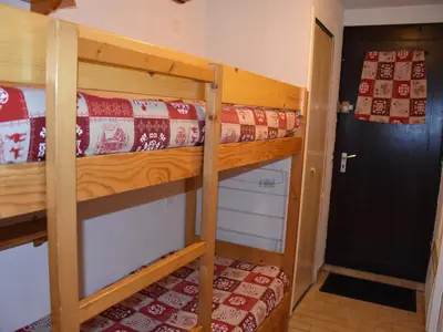 Un ou plusieurs lits dans un hébergement de l'établissement Joli studio proche centre, 4 pers, balcon - FR-1-464-173