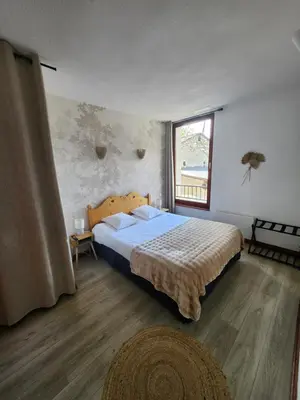 Un ou plusieurs lits dans un hébergement de l'établissement Auberge La Cascade