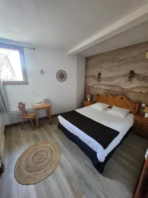 Un ou plusieurs lits dans un hébergement de l'établissement Auberge La Cascade