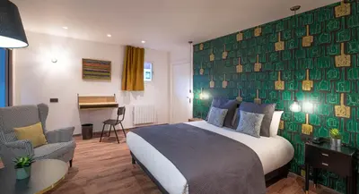 Un ou plusieurs lits dans un hébergement de l'établissement L'Outa Hotel Restaurant