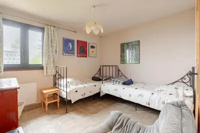 Un ou plusieurs lits dans un hébergement de l'établissement Chalet confortable avec vue sur la montagne à Peisey-Nancroix