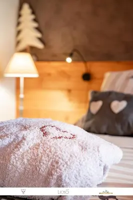 Un ou plusieurs lits dans un hébergement de l'établissement Chez Mamie Anna (B&B et Chalet)