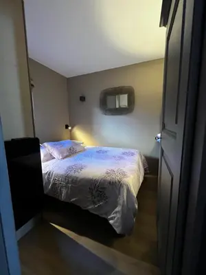 Un ou plusieurs lits dans un hébergement de l'établissement Résidence VAL VILLAGE, skis aux pieds, Duplex 3 chambres 75 m2 - by MONTBLANC LODGE