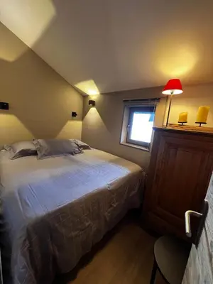 Un ou plusieurs lits dans un hébergement de l'établissement Résidence VAL VILLAGE, skis aux pieds, Duplex 3 chambres 75 m2 - by MONTBLANC LODGE
