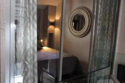 Un ou plusieurs lits dans un hébergement de l'établissement Résidence VAL VILLAGE, skis aux pieds, Duplex 3 chambres 75 m2 - by MONTBLANC LODGE