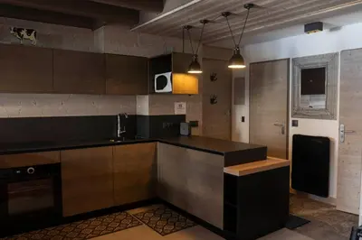 Cuisine ou kitchenette dans l'établissement Résidence VAL VILLAGE, skis aux pieds, Duplex 3 chambres 75 m2 - by MONTBLANC LODGE
