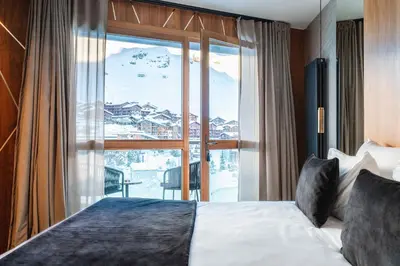 Un ou plusieurs lits dans un hébergement de l'établissement Hôtel Le Diamond Rock