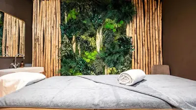 Un ou plusieurs lits dans un hébergement de l'établissement Hôtel Le Diamond Rock