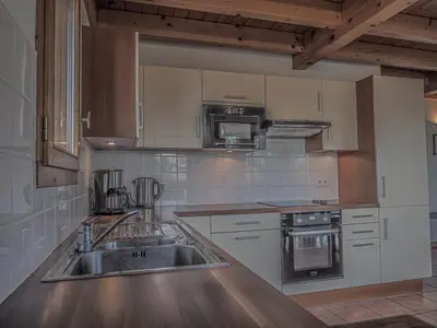 Cuisine ou kitchenette dans l'établissement La Belle Maison