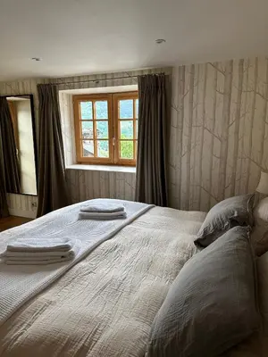 Un ou plusieurs lits dans un hébergement de l'établissement Chalet Violettes
