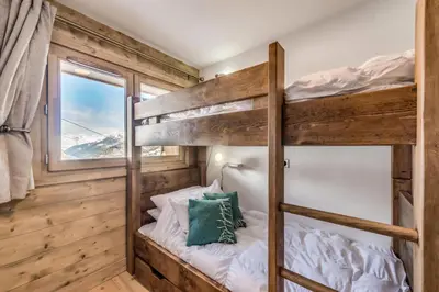 Un ou plusieurs lits dans un hébergement de l'établissement Résidence Lodge Des Neiges C - Appartement 4 - pied de pistes, service hotelier inclus MAE-2579