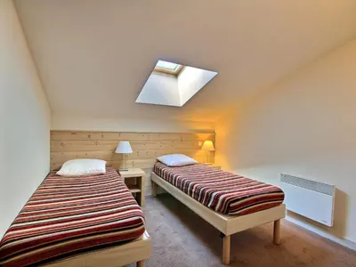 Un ou plusieurs lits dans un hébergement de l'établissement Duplex cosy 4 pers. orienté sud, accès rapide pistes - FR-1-455-178