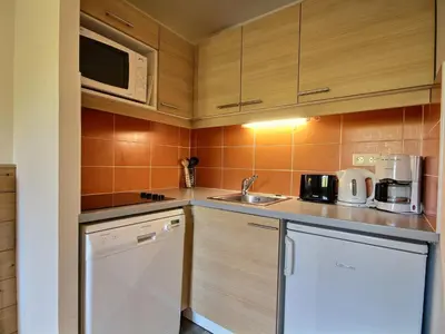 Cuisine ou kitchenette dans l'établissement Duplex cosy 4 pers. orienté sud, accès rapide pistes - FR-1-455-178