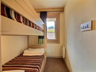 Un ou plusieurs lits dans un hébergement de l'établissement Studio cabine spacieux 4 pers. proche pistes - FR-1-455-184