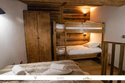Un ou plusieurs lits dans un hébergement de l'établissement MARMOTTE 204 - Charmant appartement mansardé, aux pieds des pistes