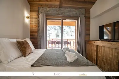 Un ou plusieurs lits dans un hébergement de l'établissement MARMOTTE 204 - Charmant appartement mansardé, aux pieds des pistes