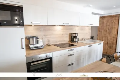 Cuisine ou kitchenette dans l'établissement MARMOTTE 204 - Charmant appartement mansardé, aux pieds des pistes