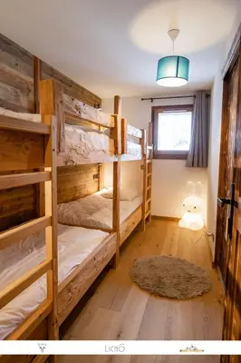 Un ou plusieurs lits dans un hébergement de l'établissement MARMOTTE 104 - Charmant T4, aux pieds des pistes