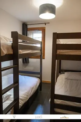 Un ou plusieurs lits dans un hébergement de l'établissement MARMOTTE 001 - Bel appartement avec grande terrasse, aux pieds des pistes