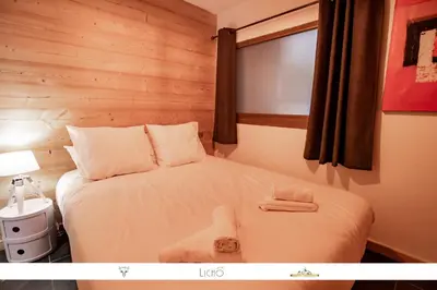 Un ou plusieurs lits dans un hébergement de l'établissement MARMOTTE 001 - Bel appartement avec grande terrasse, aux pieds des pistes