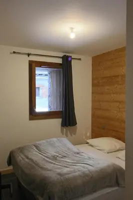 Un ou plusieurs lits dans un hébergement de l'établissement MARMOTTE 001 - Bel appartement avec grande terrasse, aux pieds des pistes