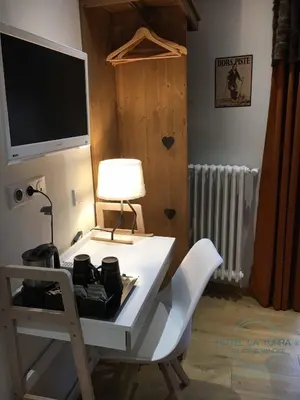 Un ou plusieurs lits dans un hébergement de l'établissement Hotel la Turra