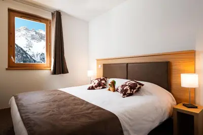 Un ou plusieurs lits dans un hébergement de l'établissement Lagrange Vacances Les Hauts de la Vanoise
