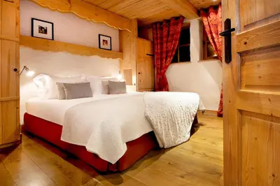 Un ou plusieurs lits dans un hébergement de l'établissement Madame Vacances Le Chalet Arosa