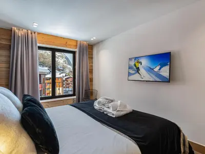Un ou plusieurs lits dans un hébergement de l'établissement Appartement luxueux 9 pers. Val-d'Isère avec parking - FR-1-567-20