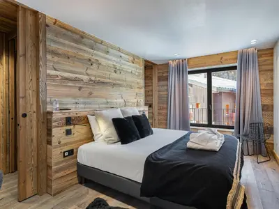Un ou plusieurs lits dans un hébergement de l'établissement Appartement luxueux 9 pers. Val-d'Isère avec parking - FR-1-567-20