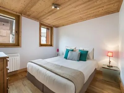 Un ou plusieurs lits dans un hébergement de l'établissement Appartement familial à Val-d'Isère avec terrasse et parking - FR-1-567-29