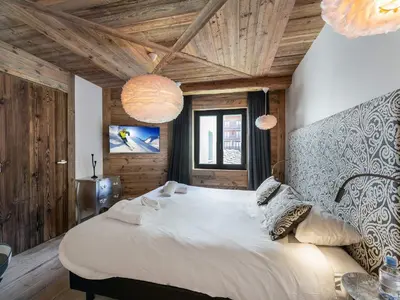 Un ou plusieurs lits dans un hébergement de l'établissement Appartement Centre Val d'Isère - Sauna, Parking, WiFi - FR-1-567-26