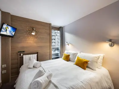 Un ou plusieurs lits dans un hébergement de l'établissement Duplex moderne à 100m des pistes, WIFI, casier à skis - FR-1-567-66