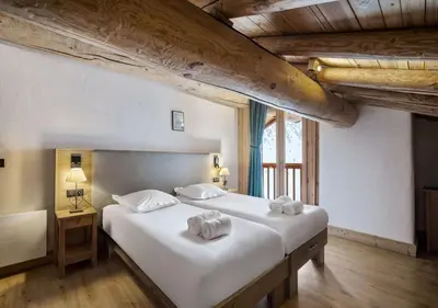 Un ou plusieurs lits dans un hébergement de l'établissement Chalet Charline