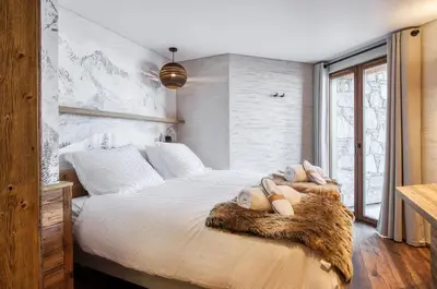 Un ou plusieurs lits dans un hébergement de l'établissement Chalet Eden Roc