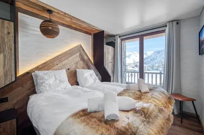 Un ou plusieurs lits dans un hébergement de l'établissement Chalet Eden Roc