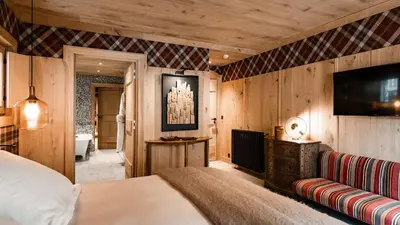 Un ou plusieurs lits dans un hébergement de l'établissement Chalets LA MOURRA