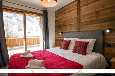 Un ou plusieurs lits dans un hébergement de l'établissement MARMOTTE 003 - Superbe T4 aux pieds des pistes