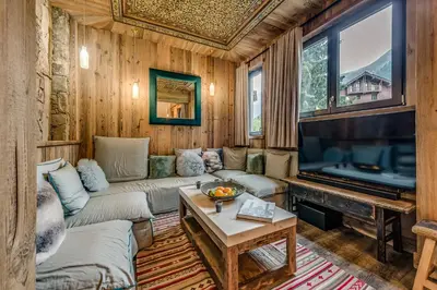 Télévision ou salle de divertissement dans l'établissement Appartement FORNET à l'Hôtel LE VAL D'ISERE