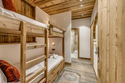 Un ou plusieurs lits dans un hébergement de l'établissement Appartement FORNET à l'Hôtel LE VAL D'ISERE
