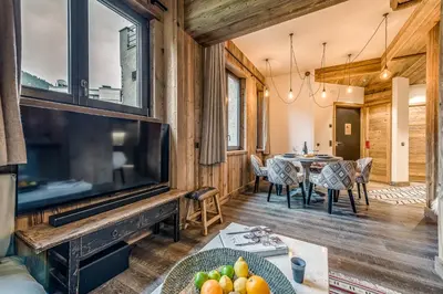 Télévision ou salle de divertissement dans l'établissement Appartement FORNET à l'Hôtel LE VAL D'ISERE