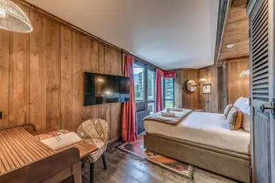 Un ou plusieurs lits dans un hébergement de l'établissement Appartement CHEVRIL à l'Hôtel LE VAL D'ISERE