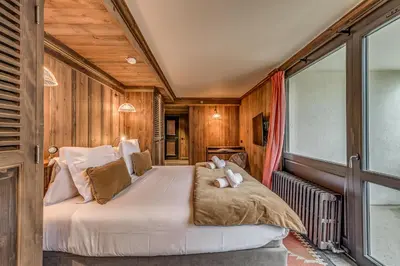 Un ou plusieurs lits dans un hébergement de l'établissement Appartement CHEVRIL à l'Hôtel LE VAL D'ISERE
