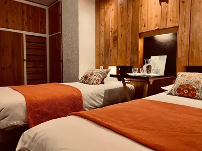 Un ou plusieurs lits dans un hébergement de l'établissement Hôtel les Lorès