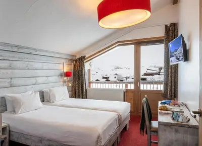 Un ou plusieurs lits dans un hébergement de l'établissement Hôtel L'Aiguille Percée