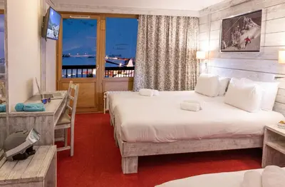Un ou plusieurs lits dans un hébergement de l'établissement Hôtel L'Aiguille Percée