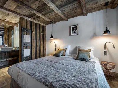 Un ou plusieurs lits dans un hébergement de l'établissement Chalet design 5* avec piscine, hammam, cinéma et parking à Val d'Isère - FR-1-567-35