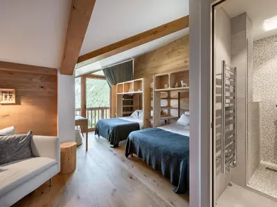 Un ou plusieurs lits dans un hébergement de l'établissement Appartement contemporain skis aux pieds avec parking au cœur de Courchevel 1650 - FR-1-563-83